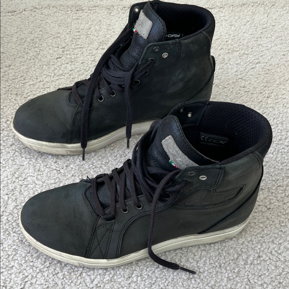 Women’s black TCX brand motorcycle boots.
